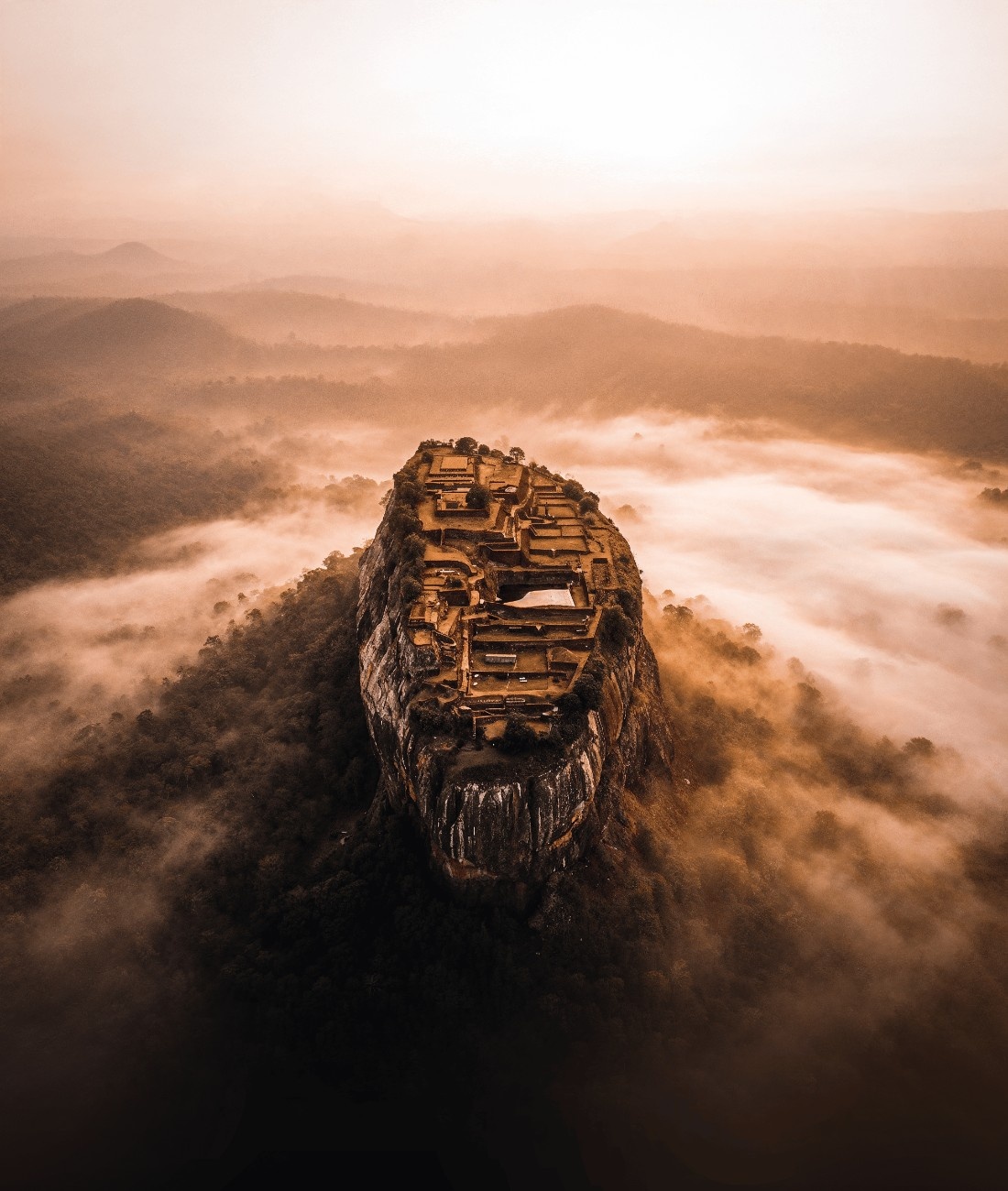Sigiriya Rock Fortress in Sri Lanka surrounded by clouds